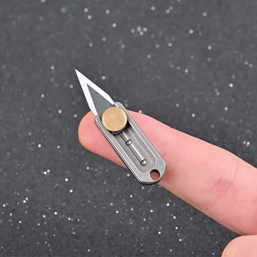 Titanium mini pusher knife, can be attached to a keychain.
