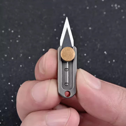 Titanium mini pusher knife, can be attached to a keychain.